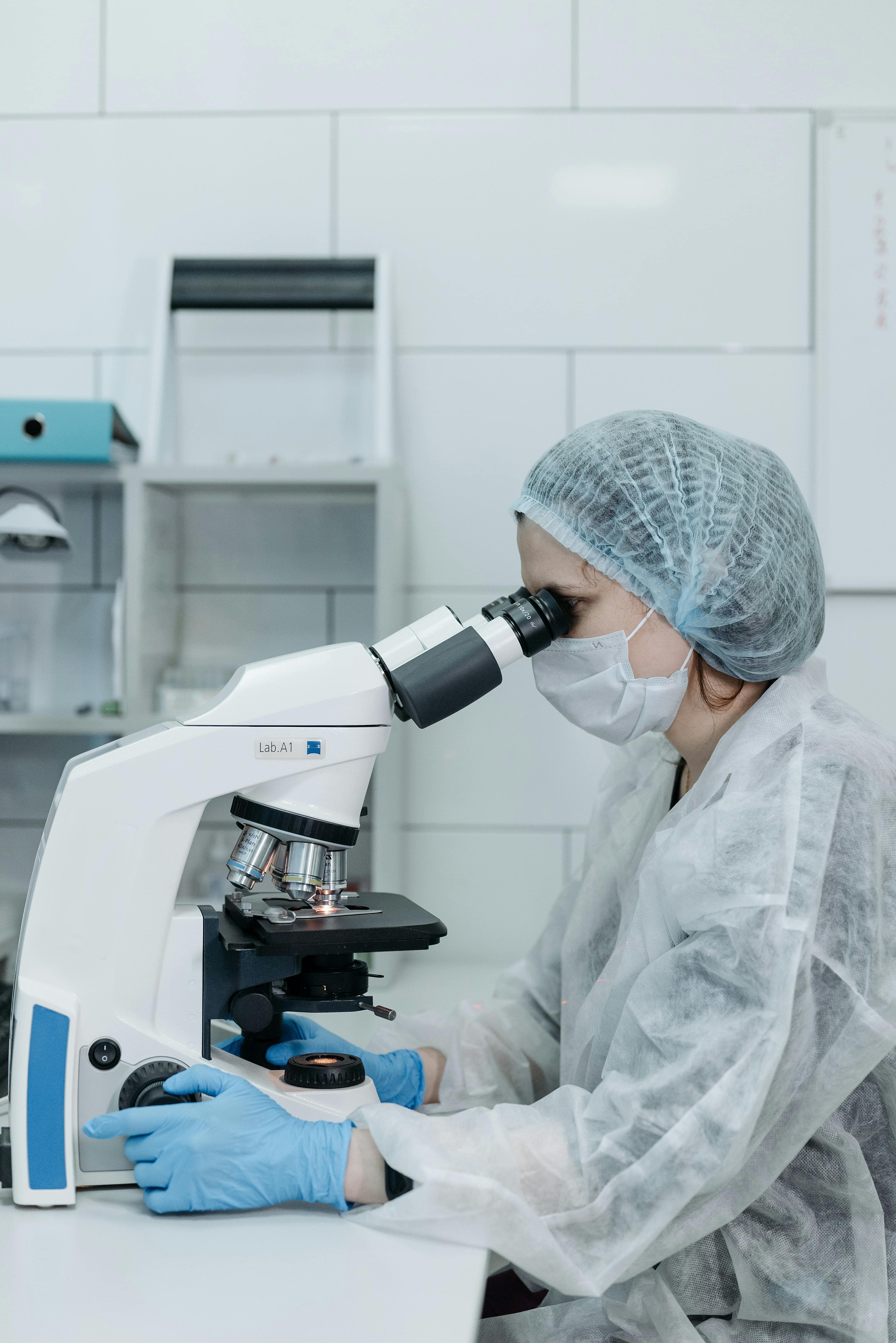 Doctor examining the blood sample to test them and create a report of the Test.