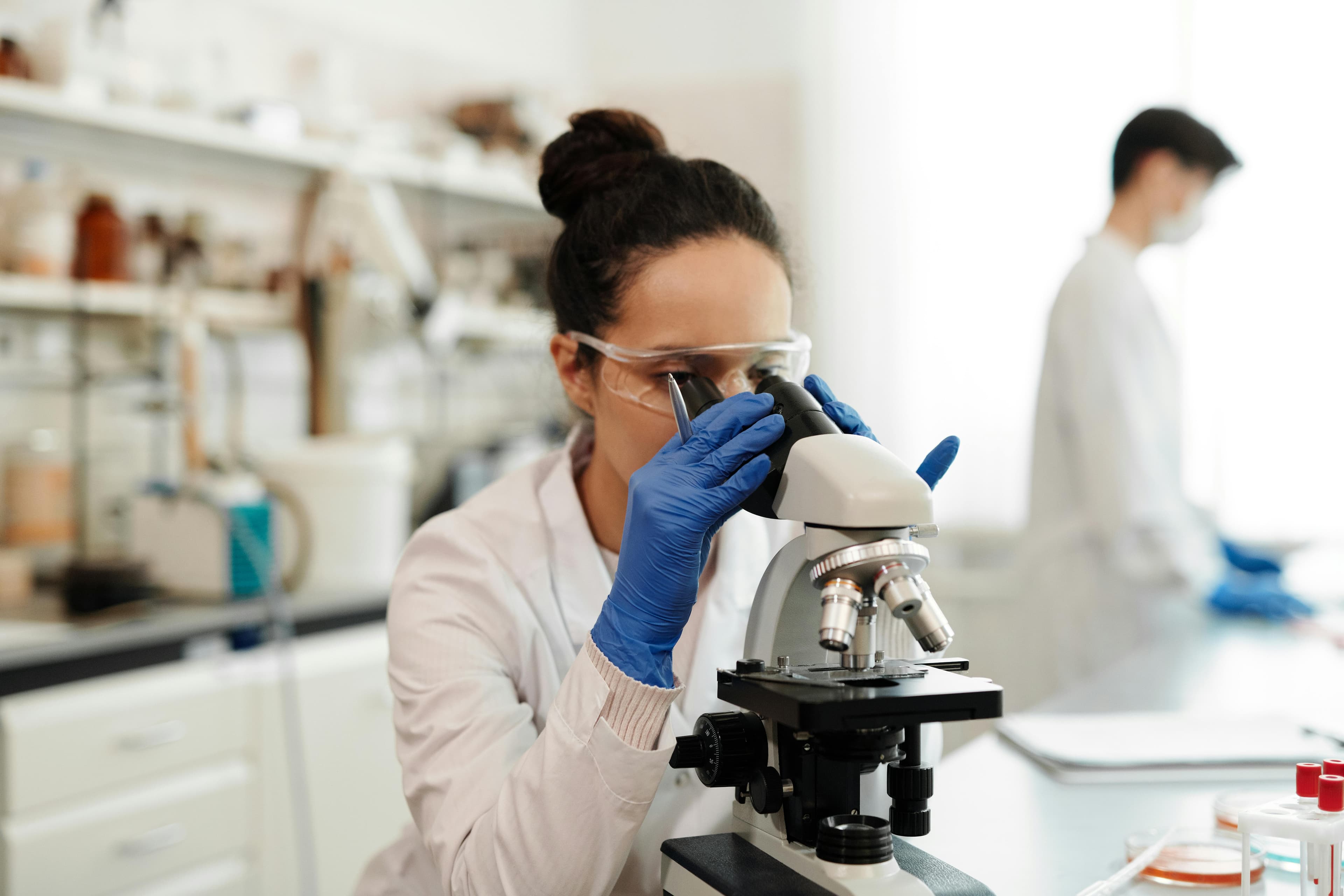 A women lab assistant doing sample test in the Lab.